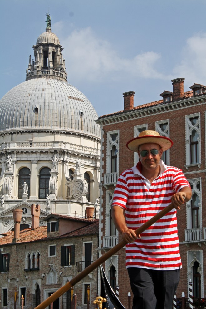 Decked out in the traditional red and white striped shirt and straw hat, our gondolier was picture perfect. 